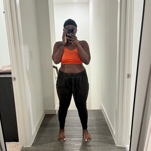 SHEIN Bright Orange Top and Black Joggers